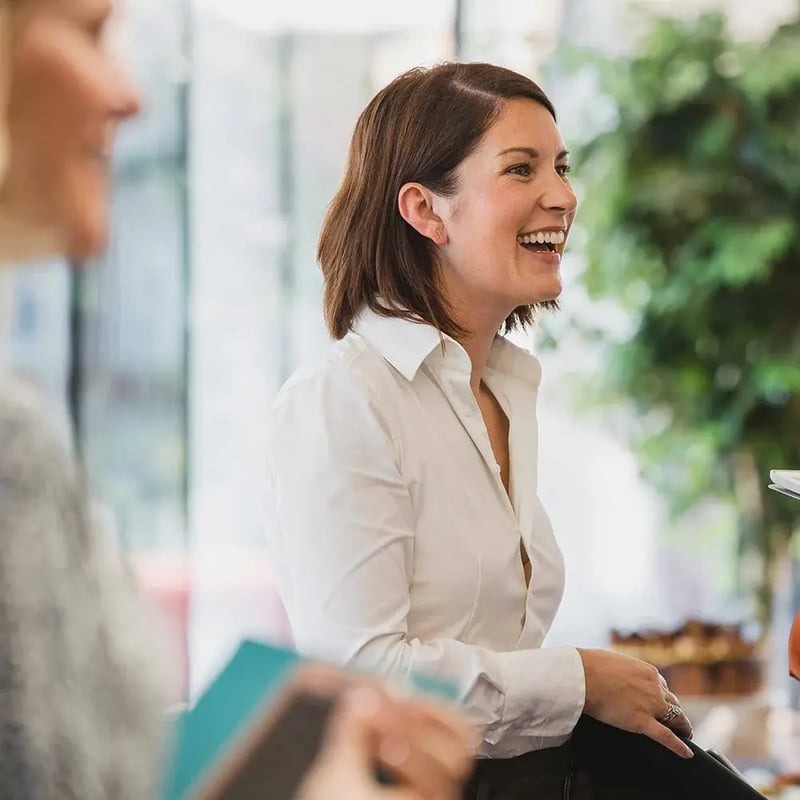 cheerful-colleagues-laughing-during-corporate-event-1