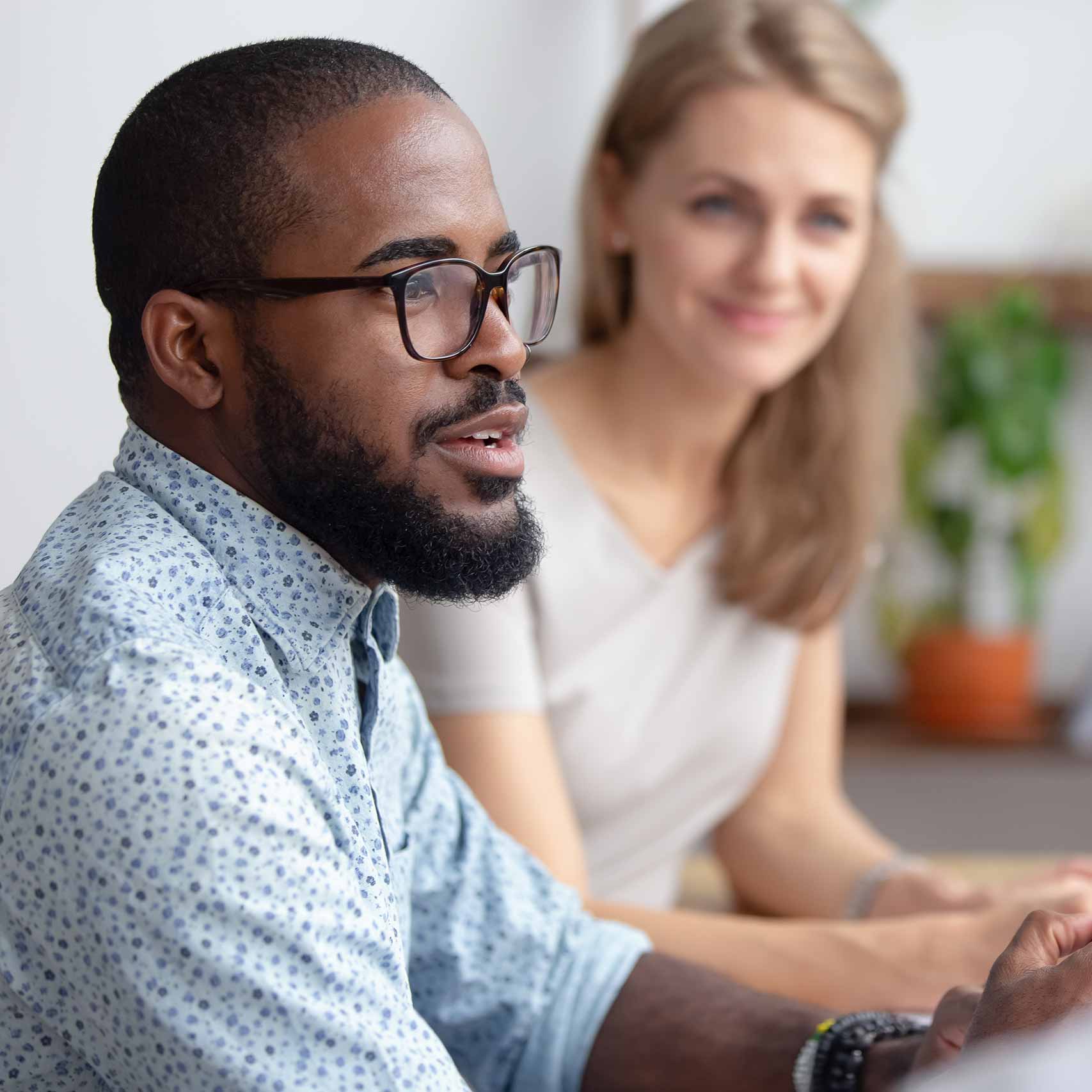 man-talking-to-co-workers
